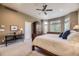 Primary bedroom featuring large windows, ceiling fan, and a dark wood armoire at 11070 Meade Ct, Westminster, CO 80031