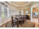 Formal dining room with chandelier, hardwood floors, and traditional decor with plenty of natural light at 11070 Meade Ct, Westminster, CO 80031