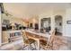 Open-concept dining area with adjacent living spaces and views into other rooms of the house at 11070 Meade Ct, Westminster, CO 80031