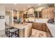 Well-appointed kitchen featuring custom cabinets, granite counters, modern appliances, and tiled backsplash at 11070 Meade Ct, Westminster, CO 80031