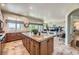 Open kitchen featuring a large island, countertops, and seamless flow into the living room perfect for entertaining at 11070 Meade Ct, Westminster, CO 80031