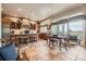 Spacious eat-in kitchen with granite countertops and large windows with a sliding door to the outside at 11070 Meade Ct, Westminster, CO 80031