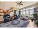 Sun-drenched living room with large windows, comfortable seating, and stylish decor makes for a relaxing space at 11070 Meade Ct, Westminster, CO 80031