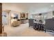 Spacious living room featuring a bar area with wine storage and ample seating, perfect for entertaining at 11070 Meade Ct, Westminster, CO 80031