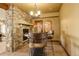 Unique bar area features stone wall, custom seating, and custom table at 28800 Stonecrop Trl, Conifer, CO 80433