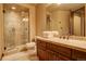 Modern bathroom with glass enclosed shower and wood vanity at 28800 Stonecrop Trl, Conifer, CO 80433