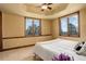 Bedroom featuring scenic windows and wood trim at 28800 Stonecrop Trl, Conifer, CO 80433