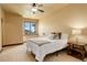 Bedroom with a ceiling fan and window with view at 28800 Stonecrop Trl, Conifer, CO 80433