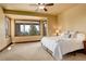 Bedroom showcasing large windows with scenic views at 28800 Stonecrop Trl, Conifer, CO 80433