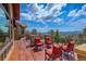 Spacious wood deck with comfortable seating offering panoramic views at 28800 Stonecrop Trl, Conifer, CO 80433