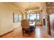 Elegant dining room featuring a stone fireplace and scenic view at 28800 Stonecrop Trl, Conifer, CO 80433