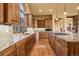 Spacious kitchen featuring custom cabinets, granite counters, and a chef's island at 28800 Stonecrop Trl, Conifer, CO 80433