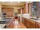 Well-appointed kitchen with custom cabinetry, granite countertops, and professional grade appliances at 28800 Stonecrop Trl, Conifer, CO 80433