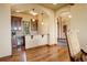 A well-appointed kitchenette area with wooden cabinetry, wine cooler, and counter seating at 28800 Stonecrop Trl, Conifer, CO 80433