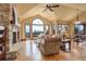 Bright living room with a vaulted ceiling, large windows, and beautiful mountain views at 28800 Stonecrop Trl, Conifer, CO 80433