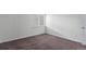 Bright bedroom with large window for natural light, plush carpeting, and a closet for convenient storage at 910 S Walden St # 106, Aurora, CO 80017