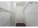 Walk-in closet with sturdy metal racks and plush carpeting, offering generous storage for clothes and accessories at 910 S Walden St # 106, Aurora, CO 80017