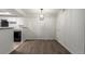 Dining area with hardwood floors and modern lighting fixture at 910 S Walden St # 106, Aurora, CO 80017