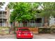 Multi-level condo with stone accents, mature landscaping, and ample parking at 910 S Walden St # 106, Aurora, CO 80017