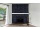 Close up of stone fireplace in the living room with mantle and hearth at 910 S Walden St # 106, Aurora, CO 80017