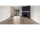 Living room features a black stone fireplace and sliding glass doors at 910 S Walden St # 106, Aurora, CO 80017