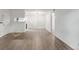 Open floor plan with hardwood floors connecting living room and kitchen at 910 S Walden St # 106, Aurora, CO 80017