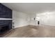 Open living space showcasing the fireplace and kitchen area at 910 S Walden St # 106, Aurora, CO 80017