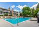 Sparkling community pool with comfortable lounge chairs, perfect for relaxation and socializing at 910 S Walden St # 106, Aurora, CO 80017