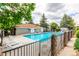 Inviting community pool surrounded by lush landscaping, offering a refreshing escape at 910 S Walden St # 106, Aurora, CO 80017