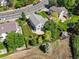 An aerial view of a home with a well-maintained yard, mature trees, and a nearby street at 11578 Clayton St, Thornton, CO 80233
