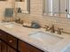 Close up of a double sink vanity, well lit and clean at 11578 Clayton St, Thornton, CO 80233