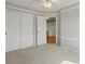 Spacious bedroom with carpet, ceiling fan, and a large closet at 11578 Clayton St, Thornton, CO 80233