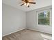 Comfortable bedroom with carpet, a ceiling fan, and a bright window with tree view at 11578 Clayton St, Thornton, CO 80233