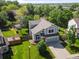 Exterior aerial view of a charming two-story home with a well-manicured lawn and mature trees at 11578 Clayton St, Thornton, CO 80233