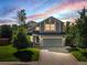 Charming two-story home with a well-maintained lawn and attached two-car garage at 11578 Clayton St, Thornton, CO 80233