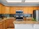 Bright and airy kitchen boasting granite countertops, stainless steel appliances, and plenty of cabinet space at 11578 Clayton St, Thornton, CO 80233