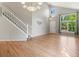Spacious living room featuring vaulted ceilings, hardwood floors, and an abundance of natural light at 11578 Clayton St, Thornton, CO 80233