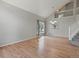 Bright, open-concept living room with hardwood floors and large windows, offering lots of natural light at 11578 Clayton St, Thornton, CO 80233