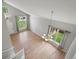 Open living room with hardwood floors, many windows and high ceilings at 11578 Clayton St, Thornton, CO 80233