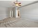 Large main bedroom featuring a ceiling fan and multiple doorways at 11578 Clayton St, Thornton, CO 80233