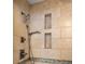 Tile shower with dual shower heads and built in shelving at 11578 Clayton St, Thornton, CO 80233