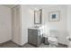 Clean bathroom with a marble countertop vanity and a closet at 7410 S Dahlia Ct, Centennial, CO 80122