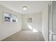 Bright bedroom featuring neutral wall colors, a closet, and ample natural light at 7410 S Dahlia Ct, Centennial, CO 80122