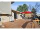 Wooden deck with outdoor seating and grill, perfect for entertaining and relaxing at 7410 S Dahlia Ct, Centennial, CO 80122