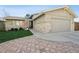 Charming single-Gathering home featuring brick and stone accents, a well-manicured lawn, and a two-car garage at 7410 S Dahlia Ct, Centennial, CO 80122