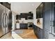 Sleek kitchen featuring modern cabinetry, stainless steel appliances, and ample counter space at 7410 S Dahlia Ct, Centennial, CO 80122