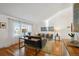 Bright and modern living room with hardwood floors, large windows, and contemporary furniture at 7410 S Dahlia Ct, Centennial, CO 80122