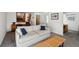 Relaxing living room with grey sofa, adjacent stairs and an artsy partition wall at 7410 S Dahlia Ct, Centennial, CO 80122