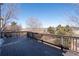 Large wooden deck providing amazing backyard views of natural landscape at 4695 Bobolink Dr, Castle Rock, CO 80109