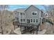 Back exterior view features multi-level deck, patio, and steps to fenced yard with landscaping at 4695 Bobolink Dr, Castle Rock, CO 80109